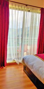 Postel nebo postele na pokoji v ubytování Hotel Nagarkot Inn