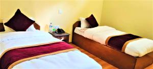Postel nebo postele na pokoji v ubytování Hotel Nagarkot Inn