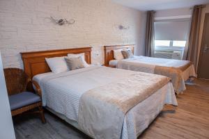 Postel nebo postele na pokoji v ubytování Hotel Motel Le Quiet