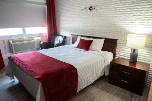 Postel nebo postele na pokoji v ubytování Hotel Motel Le Quiet