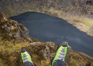 a person standing on top of a mountain overlooking a body of water at No 12 B&B in Dungarvan