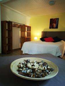 a plate of food on a table in a hotel room at Ti Coco in Trois-Rivières