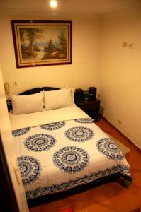 Postel nebo postele na pokoji v ubytování La Gran Fortaleza B&B