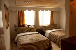 Postel nebo postele na pokoji v ubytování La Gran Fortaleza B&B