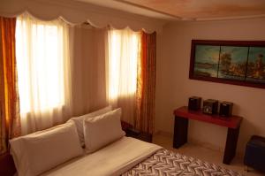 Postel nebo postele na pokoji v ubytování La Gran Fortaleza B&B