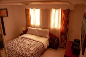 Postel nebo postele na pokoji v ubytování La Gran Fortaleza B&B