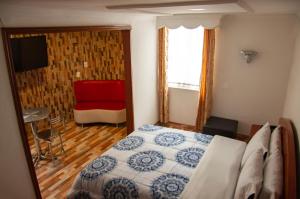 Postel nebo postele na pokoji v ubytování La Gran Fortaleza B&B