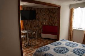 TV a/nebo společenská místnost v ubytování La Gran Fortaleza B&B + 30 fotografií