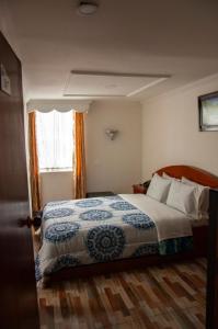 מיטה או מיטות בחדר ב-La Gran Fortaleza B&B