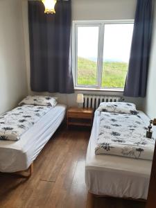 Postel nebo postele na pokoji v ubytování Hafnarnes