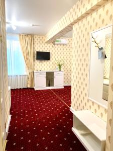 TV a/nebo společenská místnost v ubytování Sergeev Hotel