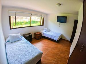 Postel nebo postele na pokoji v ubytování FINCA EL RECUERDO