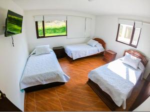 Postel nebo postele na pokoji v ubytování FINCA EL RECUERDO