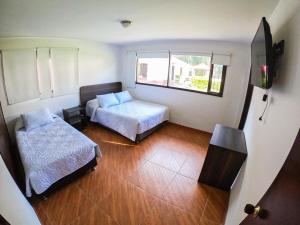 Postel nebo postele na pokoji v ubytování FINCA EL RECUERDO