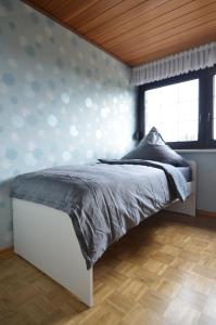 Кровать или кровати в номере Ferienwohnung Bouten A