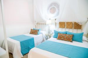 Postel nebo postele na pokoji v ubytování A&S APARTAMENTOS MALAGA I