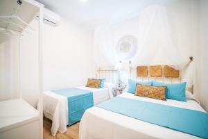Postel nebo postele na pokoji v ubytování A&S APARTAMENTOS MALAGA I
