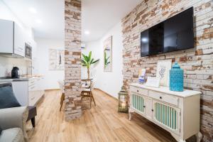 TV a/nebo společenská místnost v ubytování A&S APARTAMENTOS MALAGA I