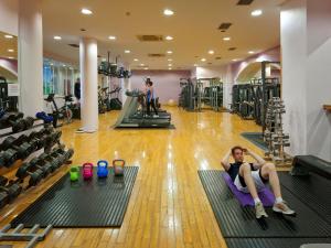 a woman laying on a mat in a gym at Ashdown Park Hotel in Gorey