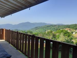 a balcony with a view of the mountains at Maison Bellevue in Geishouse