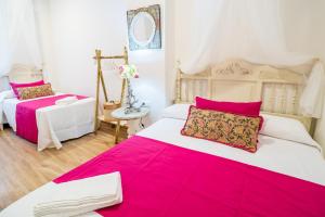 Postel nebo postele na pokoji v ubytování A&S APARTAMENTOS MALAGA I
