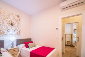 Postel nebo postele na pokoji v ubytování A&S APARTAMENTOS MALAGA I