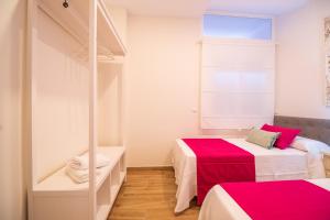 Postel nebo postele na pokoji v ubytování A&S APARTAMENTOS MALAGA I