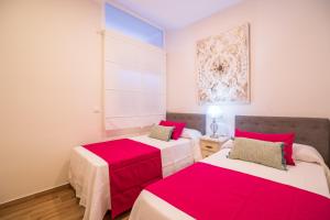 Postel nebo postele na pokoji v ubytování A&S APARTAMENTOS MALAGA I