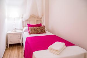 Postel nebo postele na pokoji v ubytování A&S APARTAMENTOS MALAGA I