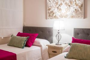 Postel nebo postele na pokoji v ubytování A&S APARTAMENTOS MALAGA I