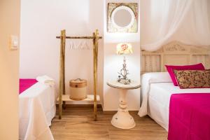 Postel nebo postele na pokoji v ubytování A&S APARTAMENTOS MALAGA I
