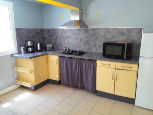 Kuchyň nebo kuchyňský kout v ubytování Habitation Diamant - Apparts & Spas
