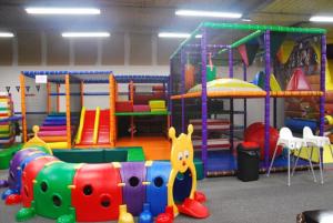 a childrens play room with different types of play equipment at Maison de ville 3 chambres 3 salles d'eau parking 2 places in Romorantin