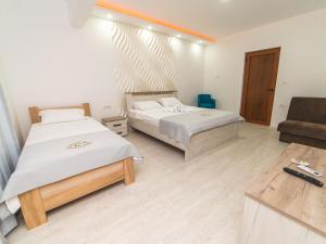 Postel nebo postele na pokoji v ubytování Hotel Royal Garden