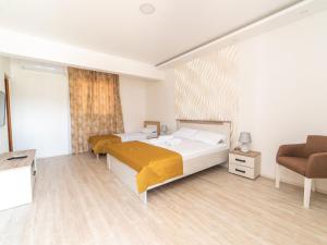 Postel nebo postele na pokoji v ubytování Hotel Royal Garden