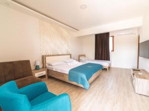 Postel nebo postele na pokoji v ubytování Hotel Royal Garden