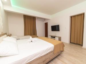 Postel nebo postele na pokoji v ubytování Hotel Royal Garden