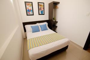 Voodi või voodid majutusasutuse Hotel Maranata Valledupar toas