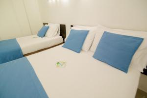 Voodi või voodid majutusasutuse Hotel Maranata Valledupar toas