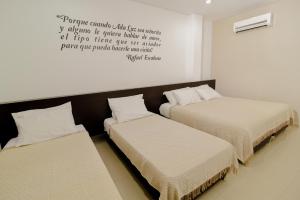 Voodi või voodid majutusasutuse Hotel Maranata Valledupar toas