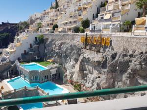 a view from a balcony of a mountain with houses at Casa Dorotea in Playa del Cura