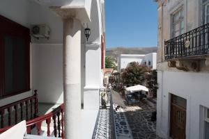 a view of a street from a balcony of a building at Chez Georges in Parikia