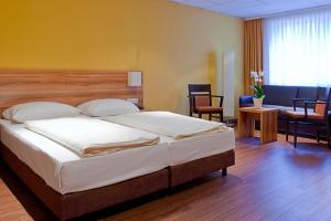 Posteľ alebo postele v izbe v ubytovaní Hotel Strohofer