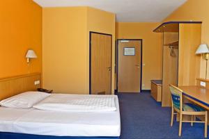 Posteľ alebo postele v izbe v ubytovaní Hotel Strohofer