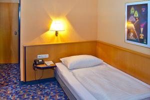 Posteľ alebo postele v izbe v ubytovaní Hotel Strohofer