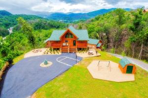 an aerial view of a house with a playground at Bella Vista Lodge in Gatlinburg