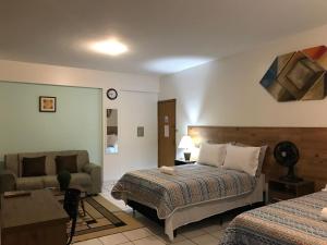 מיטה או מיטות בחדר ב-B & A Suites Inn Hotel - Quarto Luxo Exclusive