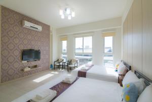 Rúm í herbergi á Amalfi Homestay