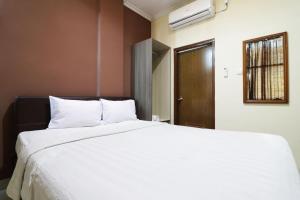 Postel nebo postele na pokoji v ubytování Hotel Istana Bungur + 19 fotografií