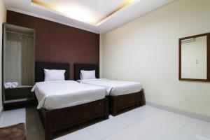 Postel nebo postele na pokoji v ubytování Hotel Istana Bungur